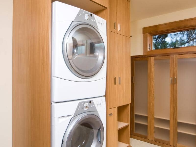 Stacked washer and dryer combo is a good choice for a small laundry room.