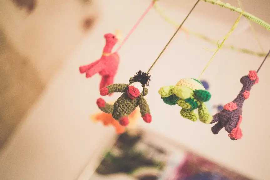 Soft Toys Hanging in a Baby's Nursery